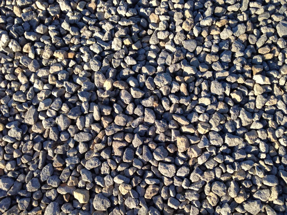 Close-up of varied gray gravel aggregate on a driveway